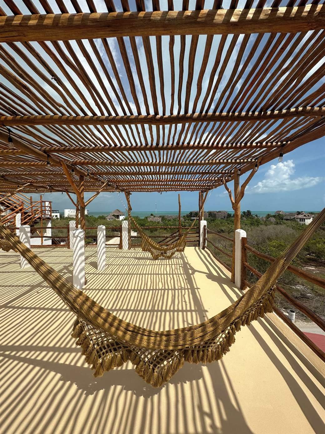 La Casa del Sol Holbox: rooftop terrace with a wooden pergola