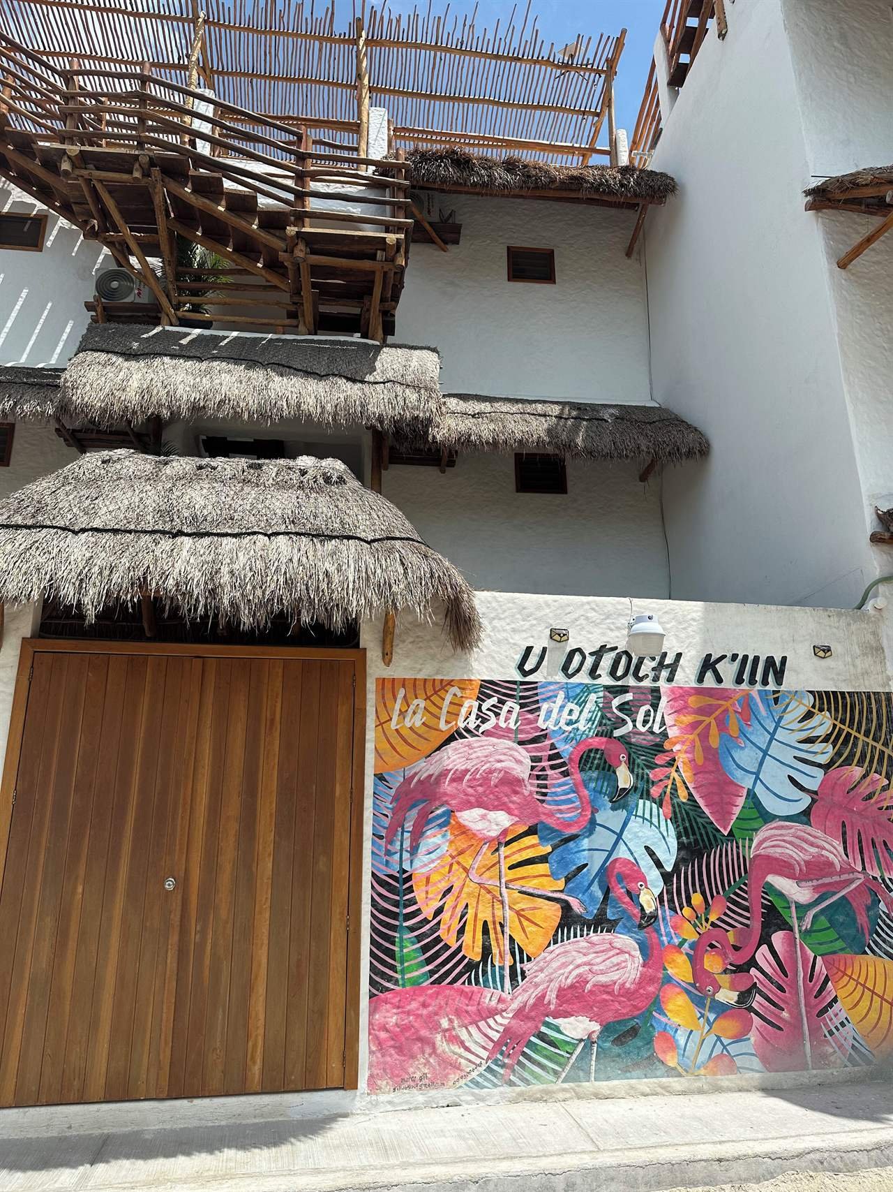 La Casa del Sol Holbox: palapa roof and colorful mural at the entrance